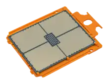 Oblique view of an AMD Ryzen Threadripper 7970X with golden-colored surface areas